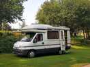 Our elderly campervan on a lovely flat pitch in welcome shade
