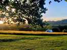 Beautiful sunset over the wild camping field