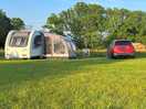 Pitch a. car is parked on pitch, caravan is outside with permission of owner