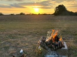 Beautiful sunset and campfire