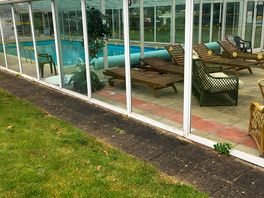 Swimming pool and cconservatory with magazines and games