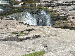 River at bottom of site