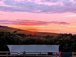 Sun setting over lynmouth holiday retreat