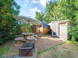 The Yellow Peewit sleeps 4 adults and 2 children, with a spacious outdoor dining and BBQ area.