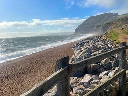 Having a drink outside the pub with sea view