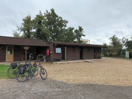 Toilets and showers near entrance.