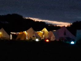 The glamping pods looked so pretty at night.