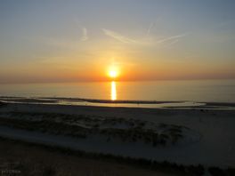 Sunset over the beach at corfwater