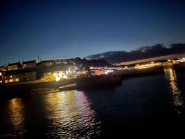 The harbour and surroundings are lit up at night,very pretty.