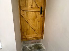 Door from bathroom two steps down into bathroom