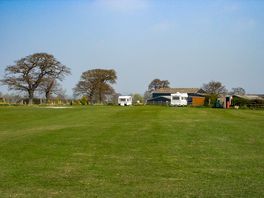 Camping field surrounded by trees