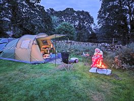 Stick a free fire mat under your firepit/bbq. provided by the campsite.