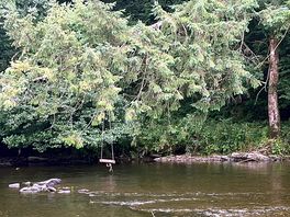 The river next to the site, and the view from our pitch