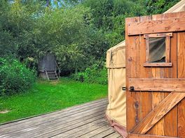 Toilet shack at back of yurt