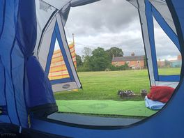 View of the meadow, house from our tent.