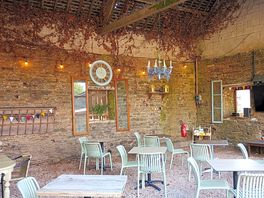 Rustic seating area next to a fabulous outdoor kitchen.