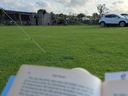Sat reading my book whilst my son played on the park within sight.