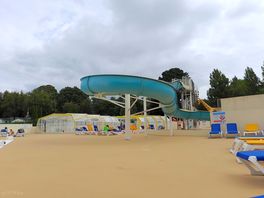 View of pool area and slides
