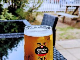 Beer garden. lots of tables for outdoor dining and eating.