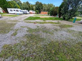 Fully serviced pitch area. comparatively tired and scruffy against rest of site pitches.