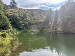 Water filled quarry pit, many people were swimming