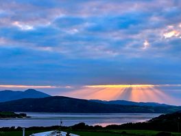 Watch the sunset over the bay from.the campsite