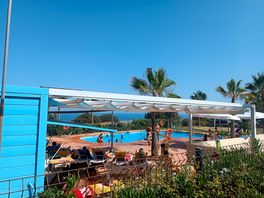 The pool area and snacks bar.