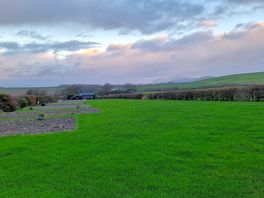 Pleasant surroundings, bordered by fields of sheep and the road