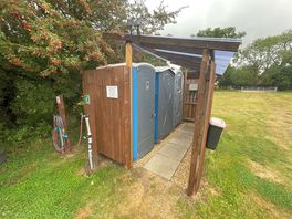Toilet, water and shower block