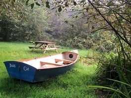 Little boat next to the lake