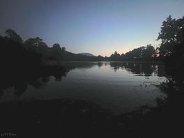 Night falls at the small loch near de campsite