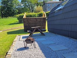 Upturned wooden canopy with no hot tub.