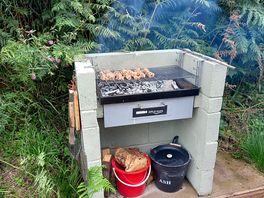 Bbq set next to the pod.