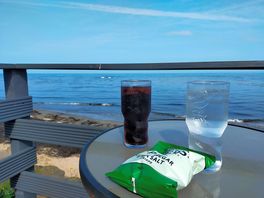 Fishing boat inn has a lovely terrace overlooking the beach.