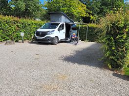 My partner relaxing at our pitch and you can see it's a great size pitch as they all are