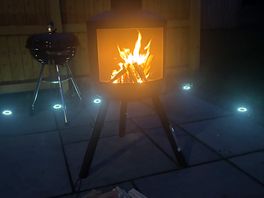 Log fire lit at night wood provided