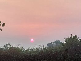 Sun setting over camp