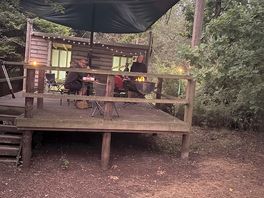 Log cabin with bbq and gas stove for everyone to use.