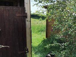 Proximity of composting toilet to cabin