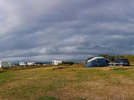 The tent pitch area, with nice short grass, dry and firm ground.