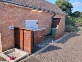 Sink and building with shower and toilets