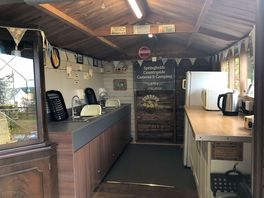Washing up area which also has a fridge, freezer, kettle and microwave to use