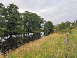 River running behind the site