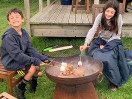 Our children toasting marsh mallows over the fire pit.
