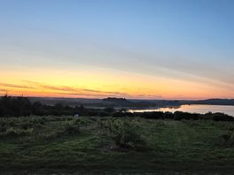 Sunset over the lake. view from pitch at top