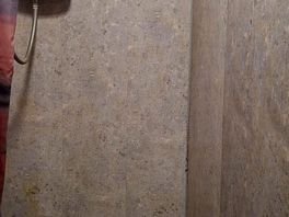 One shower stool at main door. small dirty and light on a timer that kept going off