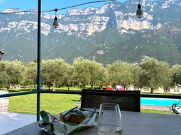 Glass of their wine by the pool, ice bucket provided to keep cool.