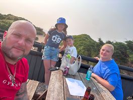 Enjoying a cold one at ocean beach bar in brean