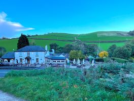 A view of pub and site from public footpath across the road