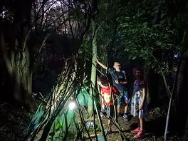 Den building in the woods behind our pitch.